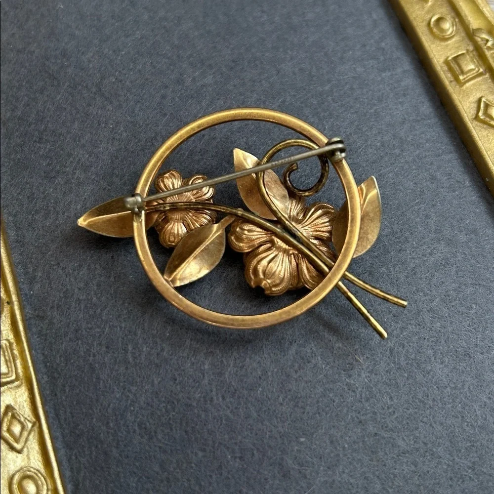 vintage Krementz brooch featuring floral designs in a mixed rose and yellow gold